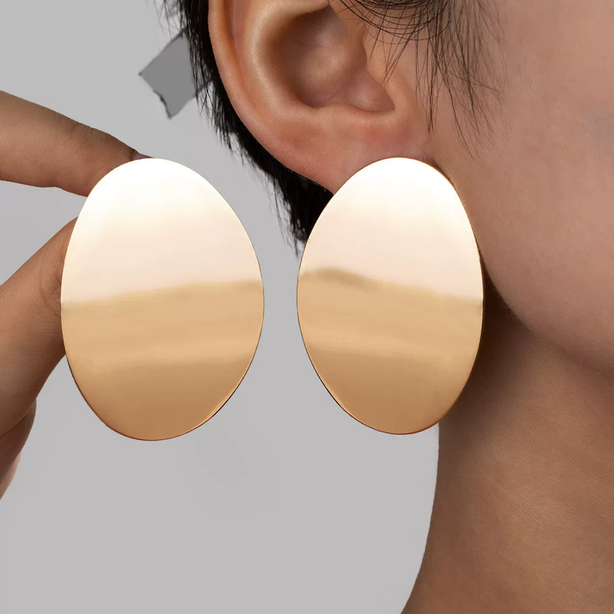 Brincos Eclipse Escultural